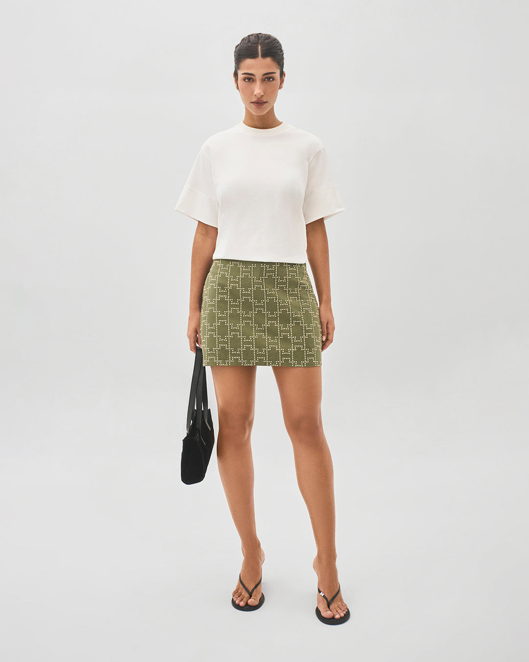 Short saia com pedras monograma H verde